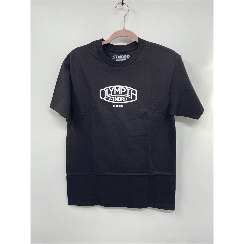 Stndrd Olympia 2025 T-Shirt Mens M Black Champion Mentality Never Retires NWOT